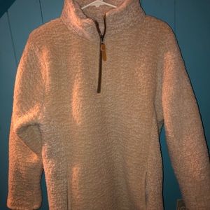 color is tan, long neck, and zipper pockets.